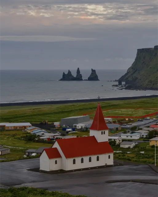 Red-roofed church by the sea
